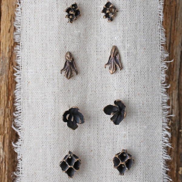 Four pairs of different tree jewelry